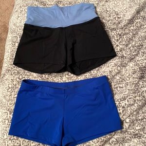Two pairs of nylon/spandex child size large shorts.